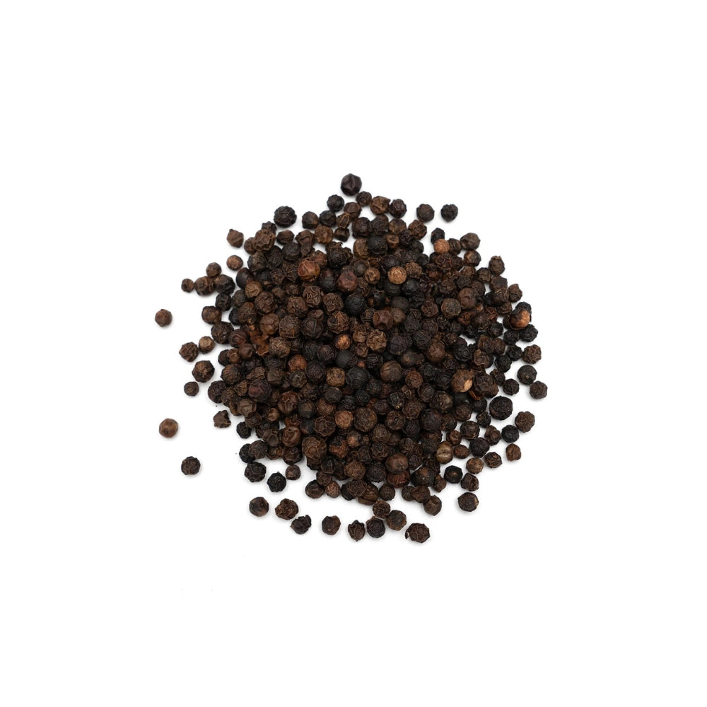 Close-up of whole black peppercorns