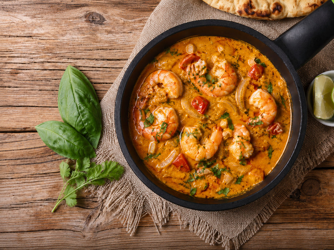 Creamy coconut turmeric prawn curry with coriander and lime
